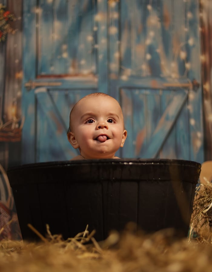 Baby sitting in cauldron — creative portrait