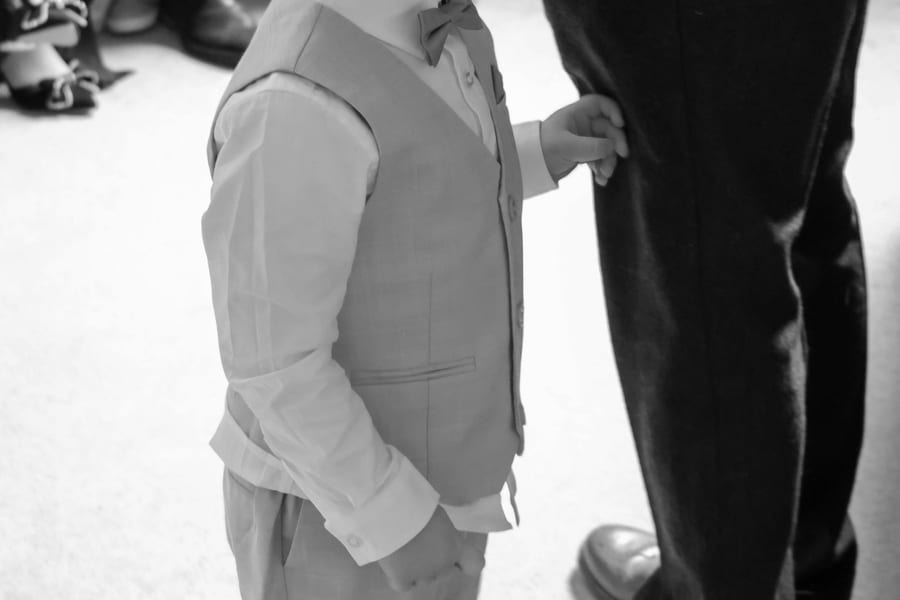 Toddler in formal suit at wedding