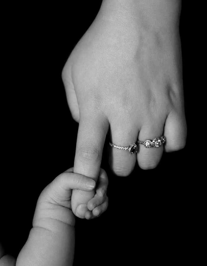 Mother and child holding hands