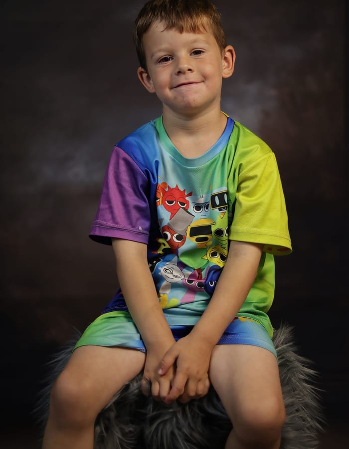 Young boy in colourful shirt — portrait